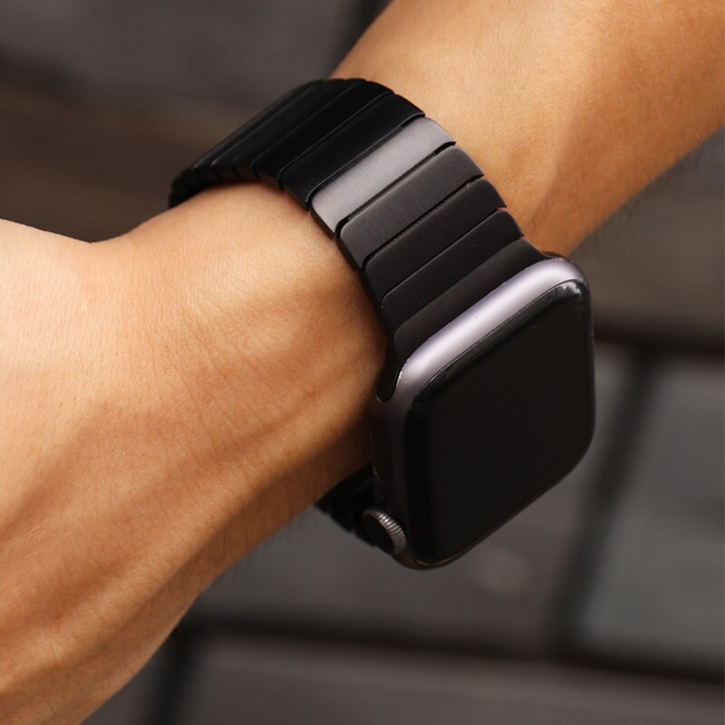 Black Stainless Steel Link Band for Apple Watch worn on a persons wrist